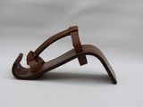 brown leather sandals on a white surface with a white background