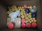 a box full of candles and other items in it