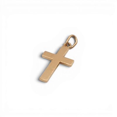 un pendentif en forme de croix dorée sur fond blanc