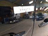 a close up of a car door handle with a sticker on it