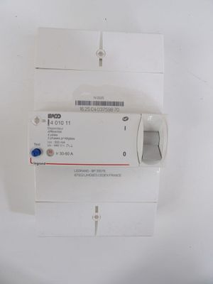 a white electrical device with a blue button on it