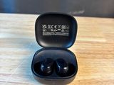 a close up of a pair of earphones in a case on a table