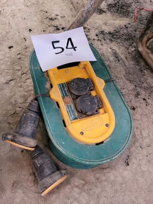 a yellow and green toy boat with a number 54 on it