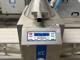 an image of a machine that is sitting on a conveyor belt
