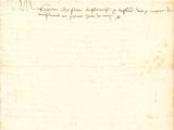 an old document with writing on it sitting on top of a table