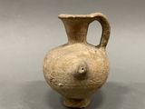 a small vase that is sitting on a table