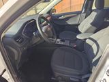 the interior of a car with a steering wheel and a dashboard