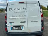 a white van that is parked on the side of the road