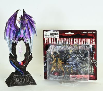 a figurine of a dragon with a purple and black dragon on it