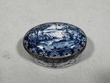 a blue and white bowl sitting on a table