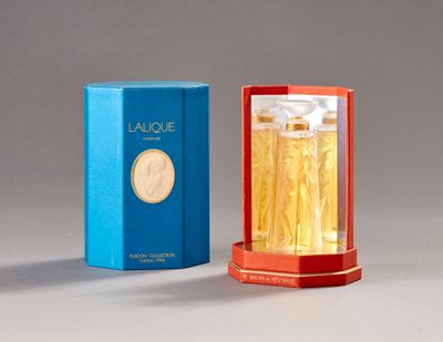 an image of a bottle of perfume next to a box of perfume