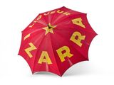 un parapluie rouge orné d'une étoile jaune