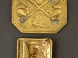 two gold medals with a picture of a man and a woman on them