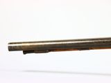 a close up of a gun on a white surface with a white background