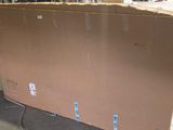 a large cardboard box sitting on a pallet in a warehouse