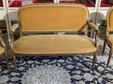 three chairs and a couch in a room with a blue rug