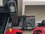 two phones that are sitting on the floor next to each other