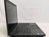 the laptop is sitting on a white surface with a white background