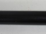 a close up of a black pipe on a white surface