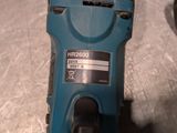a blue drill that is sitting on a table