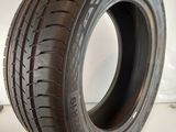 a close up of a tire on a white surface