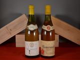 two bottles of wine sitting next to each other on a table