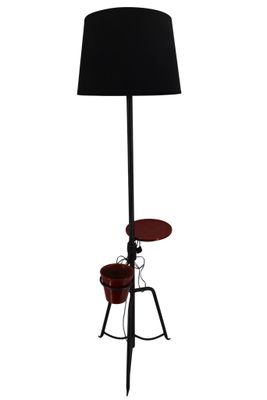 Lampadaire tripode en métal laqué noir formant jardinière et…