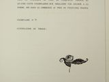 an open book with a drawing of a flower on it