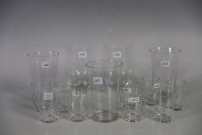a lot of glass vases that are sitting on a table