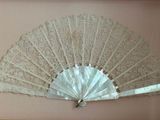a picture of a picture of a white fan on a wall