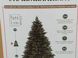 packaging of a christmas tree in a cardboard box on a table