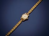 an image of a gold wrist watch on a blue background