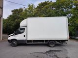 a white truck that is parked on the side of the road