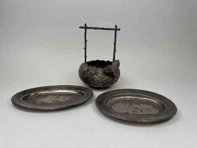 pair of silver plate holders with a cross on top of them