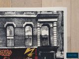 an image of a black and white photo of a building with graffiti on it