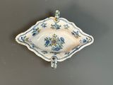 an image of a blue and white bowl with flowers on it