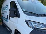 a white van parked on the side of the road