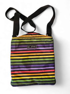a multicolored striped bag with a black strap