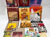many children ' s books are lined up on a white surface