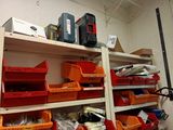 many bins and boxes on the shelves in the garage