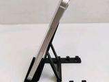 a cell phone that is sitting on a stand