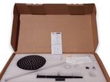 a cardboard box with a hair brush, comb, and other items in it