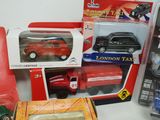 several toy cars and trucks are sitting on a table
