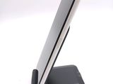 a cell phone that is on a stand on a table