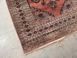 rug on the floor with a cat laying on it ' s side