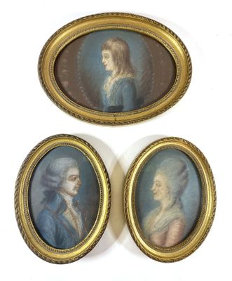 three framed portraits of a woman and a man in a blue dress