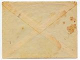 an old envelope with a torn piece of paper on top of it