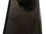 a bottle of liquid sitting on top of a black tray