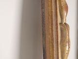 a mirror that has a gold frame with a cat on it