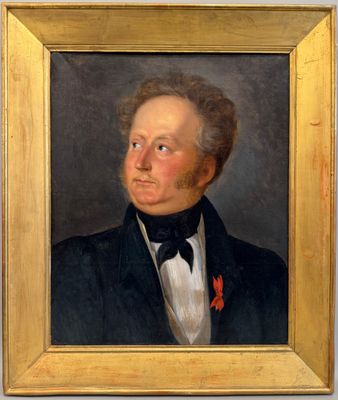 portrait d'un homme en smoking dans un cadre doré